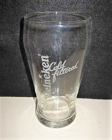 beer glass from the Heineken brewery in Netherlands with the inscription 'Heineken Cold Filtered'