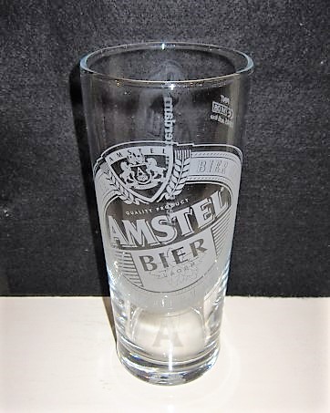beer glass from the Amstel brewery in Netherlands with the inscription 'Amstel Lager Bier Brouwerij B.V Amsterdam Holland. Quality Product Amstel Bier'