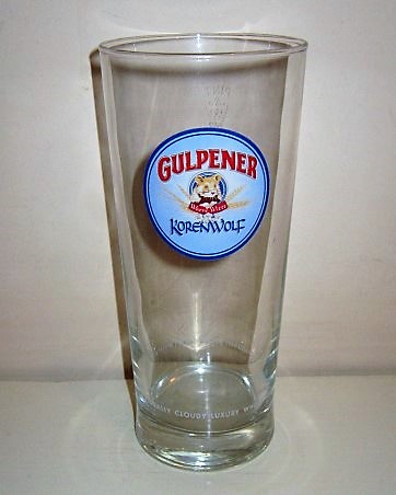 beer glass from the Gulpener brewery in Netherlands with the inscription 'Gulpener Koren Wolf, Naturally Cloudy Luxury Wheat Beer'