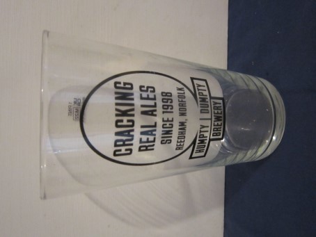 beer glass from the Humpty Dumpty brewery in England with the inscription 'Humpty Dumpty Brewery, Cracking Real Ale Since 1998 Reedham Norfolk'